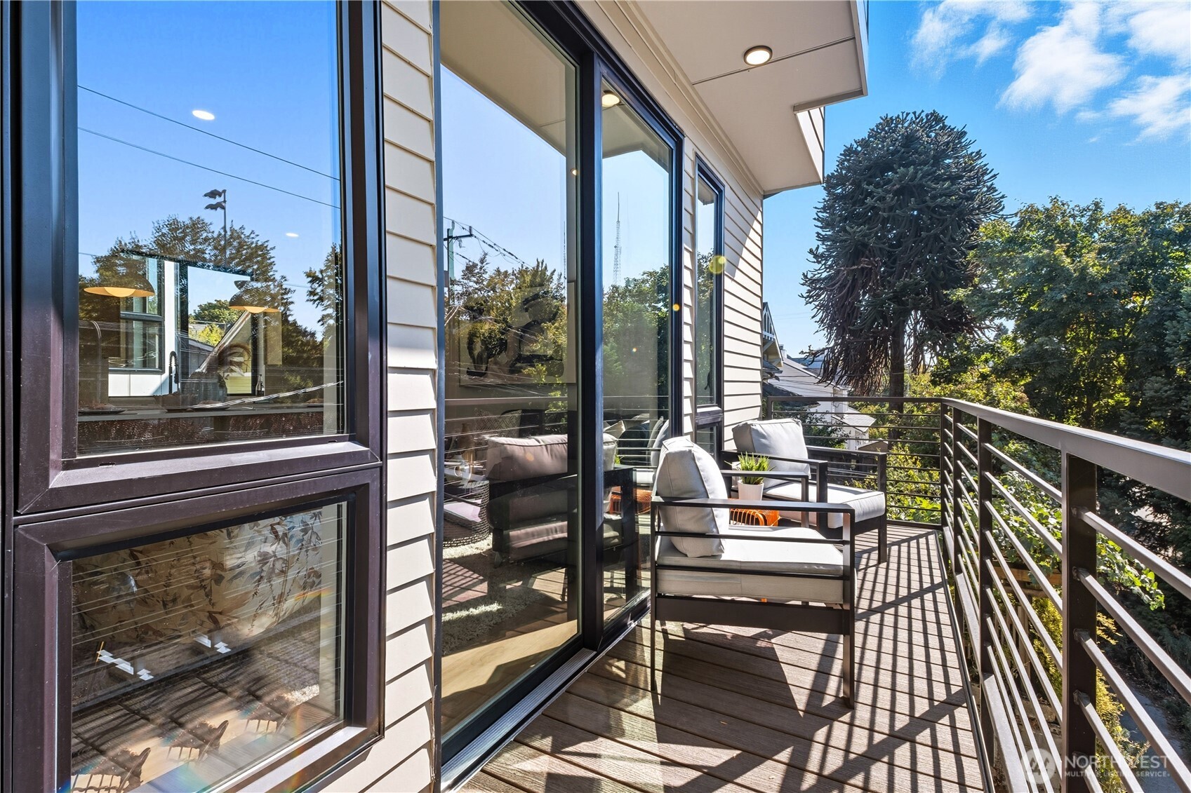 220 21st Avenue East Seattle, WA 98112 - Photo 17 of 38 a balcony view with a large window and outdoor seating
