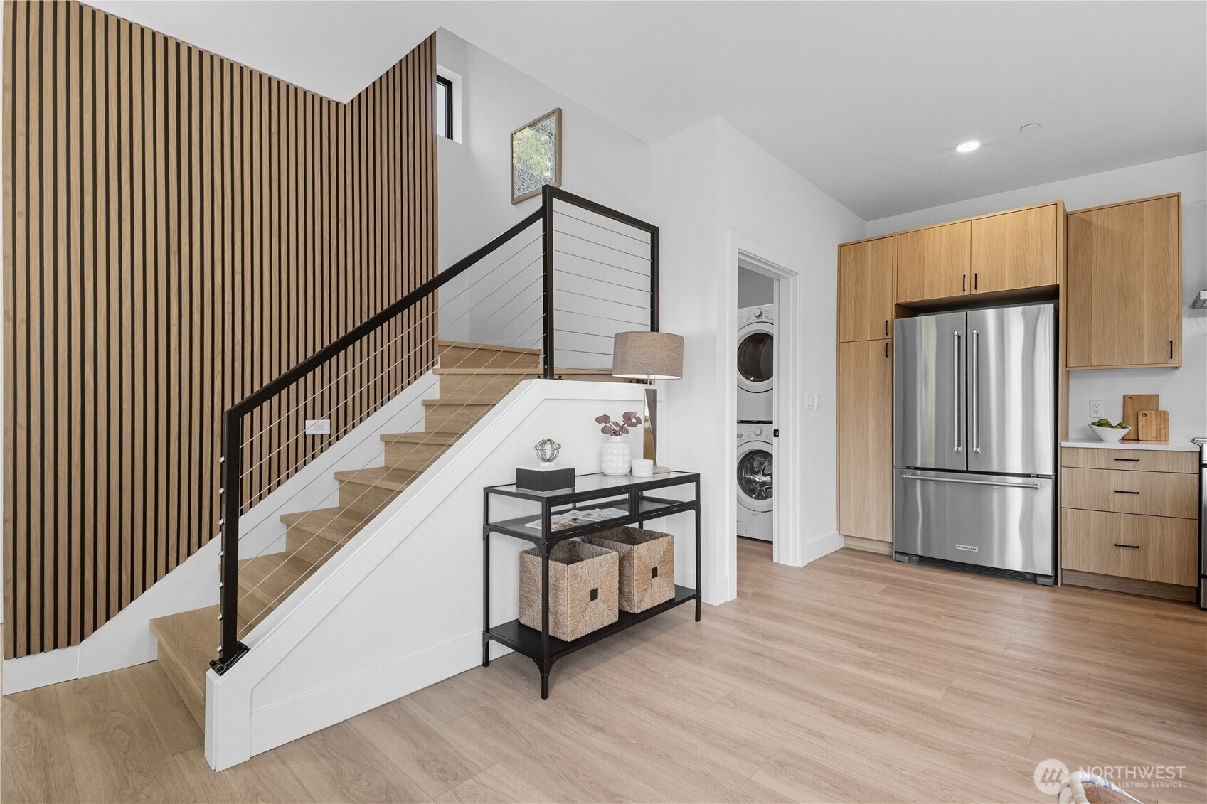 220 21st Avenue East Seattle, WA 98112 - Photo 20 of 38 a kitchen with stainless steel appliances wooden floor and more cabinets