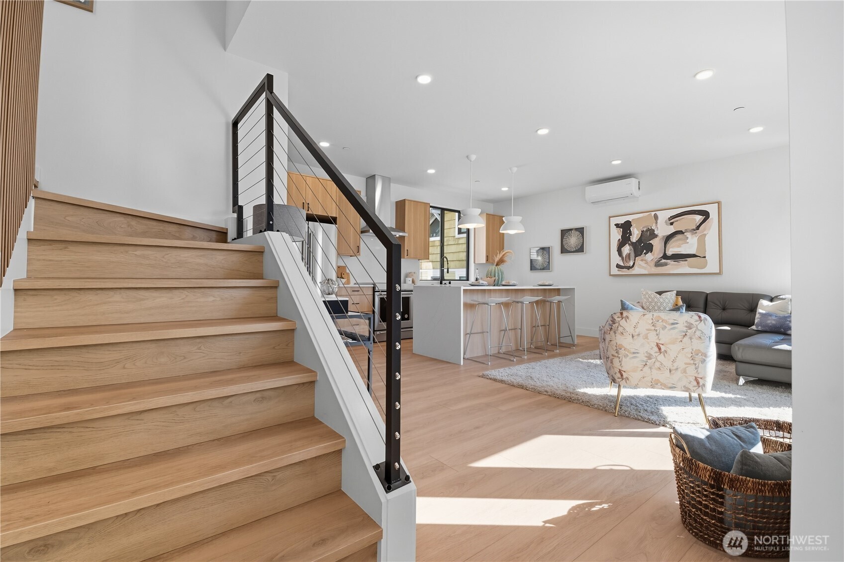 220 21st Avenue East Seattle, WA 98112 - Photo 22 of 38 a living room with furniture and stairs
