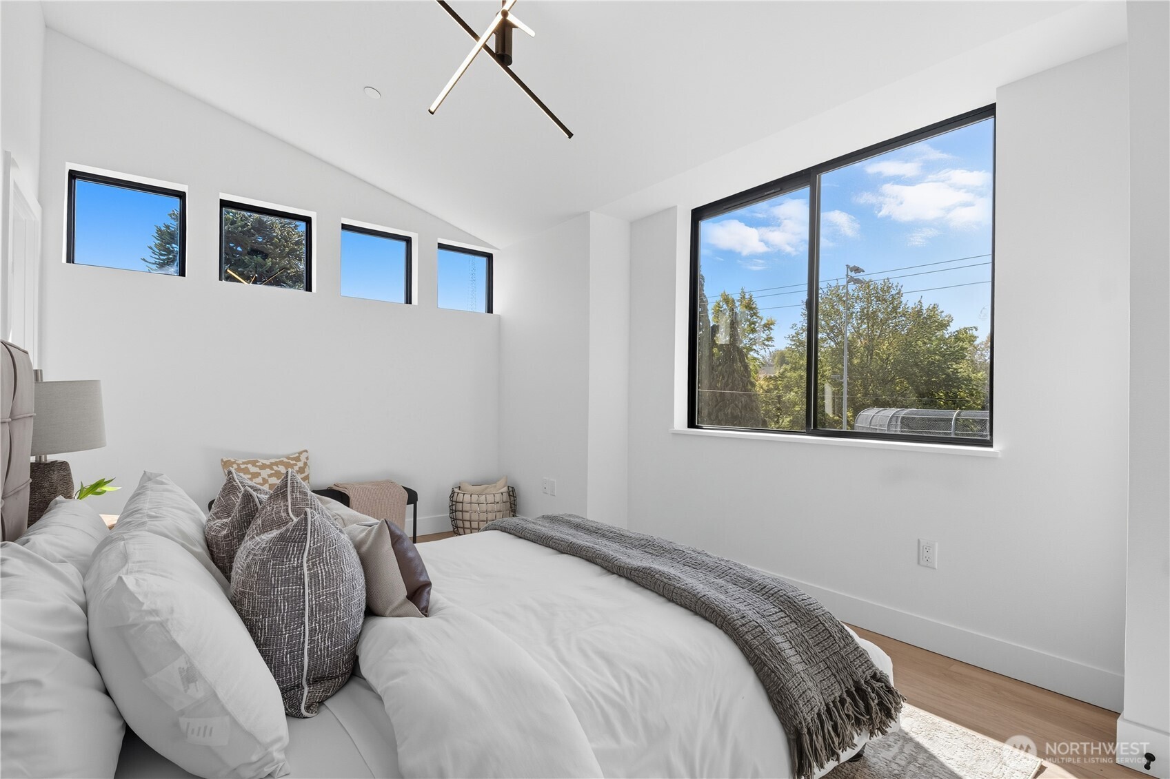 220 21st Avenue East Seattle, WA 98112 - Photo 23 of 38 a bedroom with a bed and a window