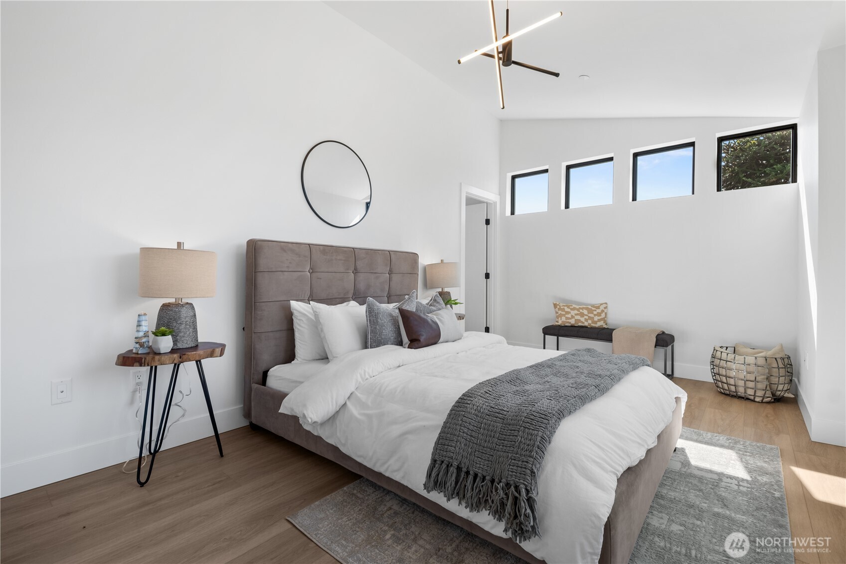 220 21st Avenue East Seattle, WA 98112 - Photo 24 of 38 a bedroom with a bed and wooden floor