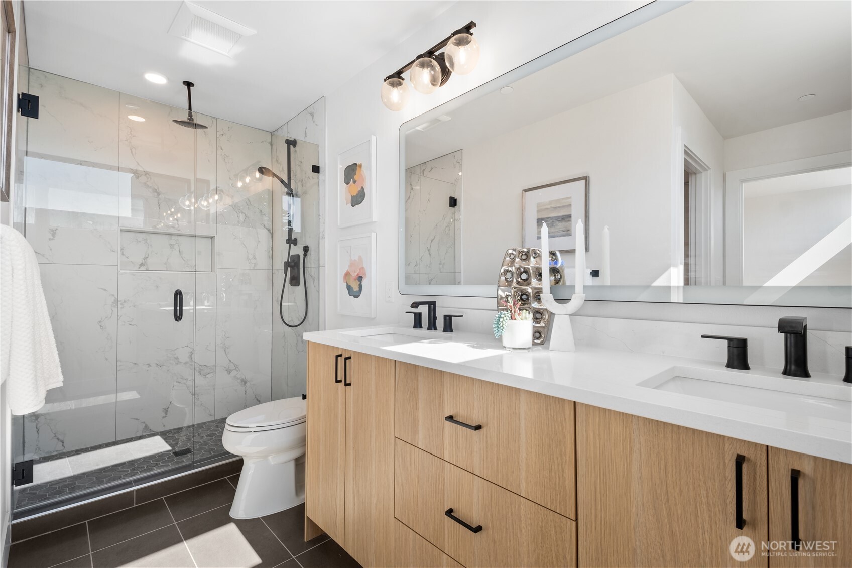 220 21st Avenue East Seattle, WA 98112 - Photo 26 of 38 a bathroom with a double vanity sink toilet and shower