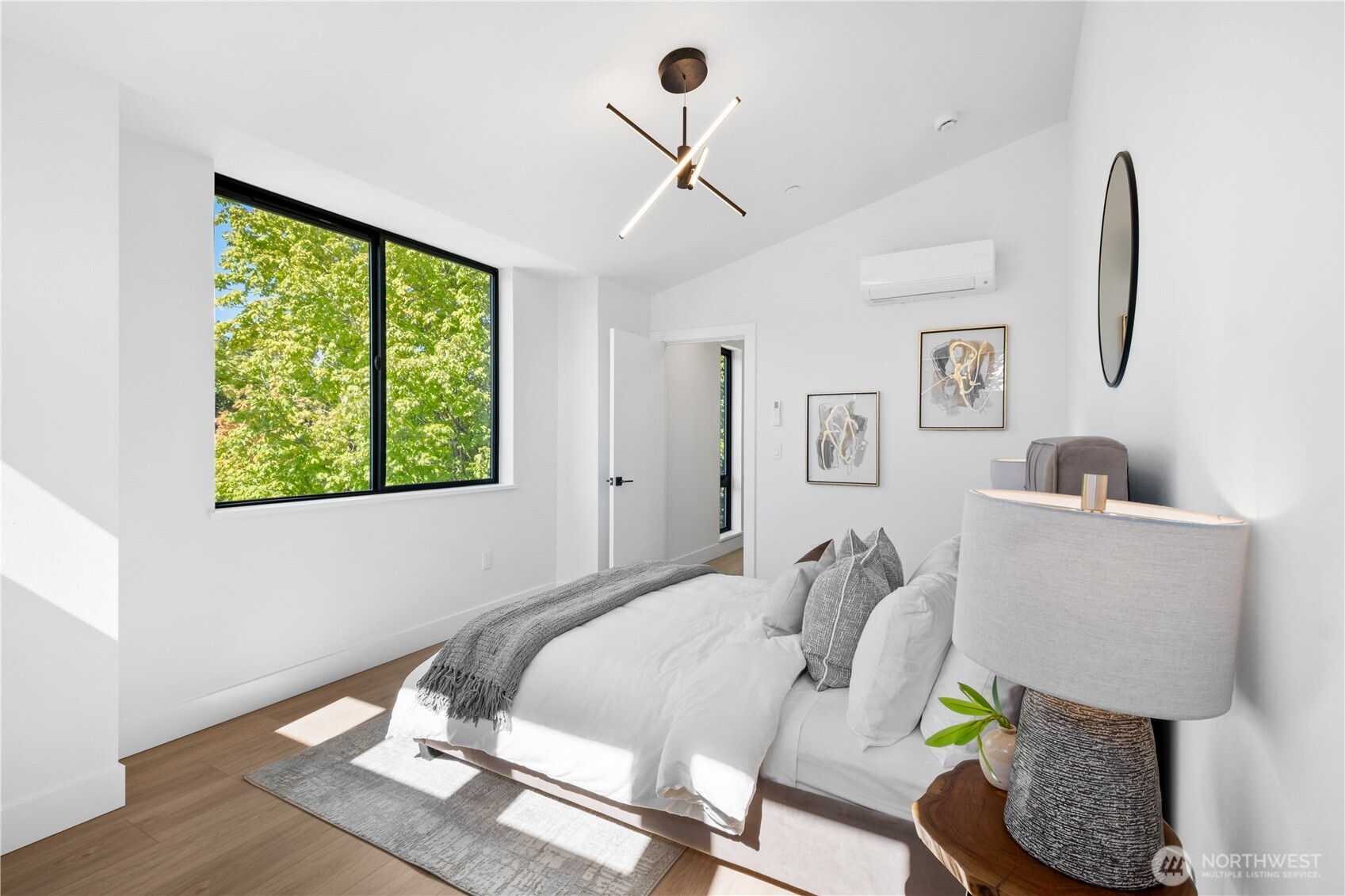 220 21st Avenue East Seattle, WA 98112 - Photo 29 of 38 a bedroom with furniture and a window