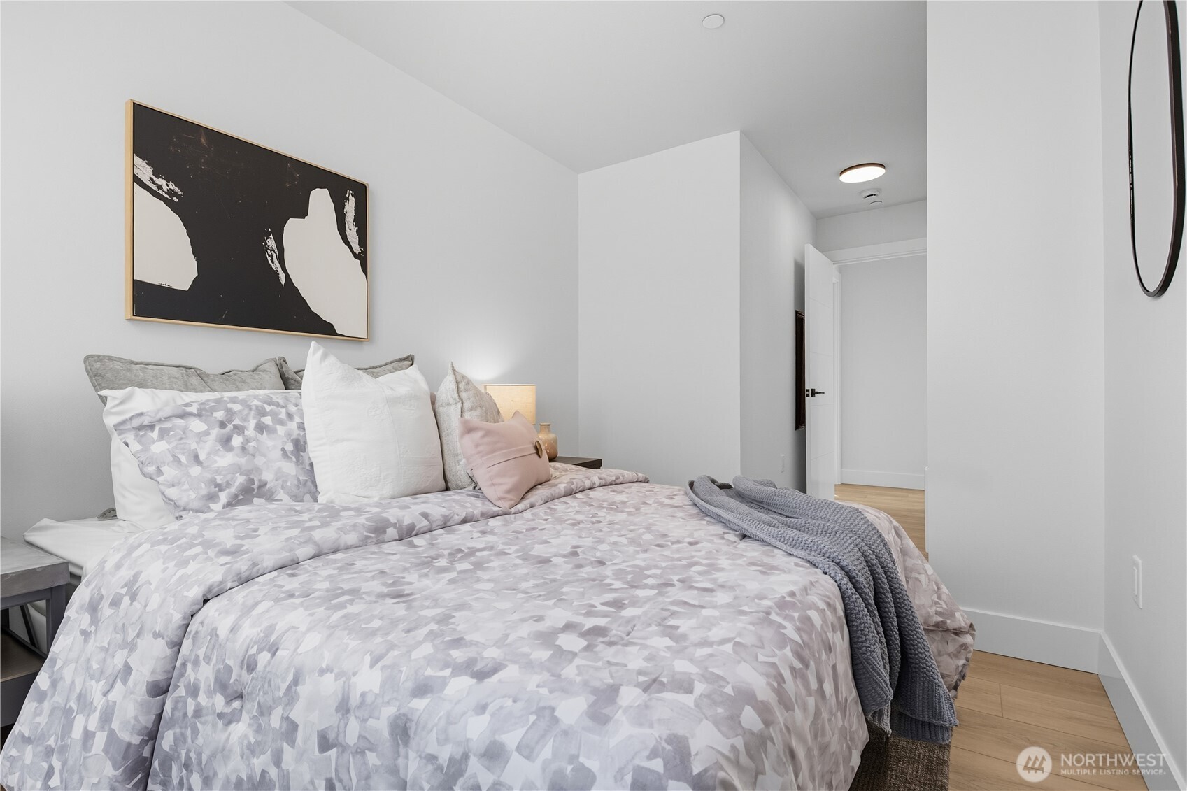 220 21st Avenue East Seattle, WA 98112 - Photo 32 of 38 a bedroom with a bed and a painting on the wall