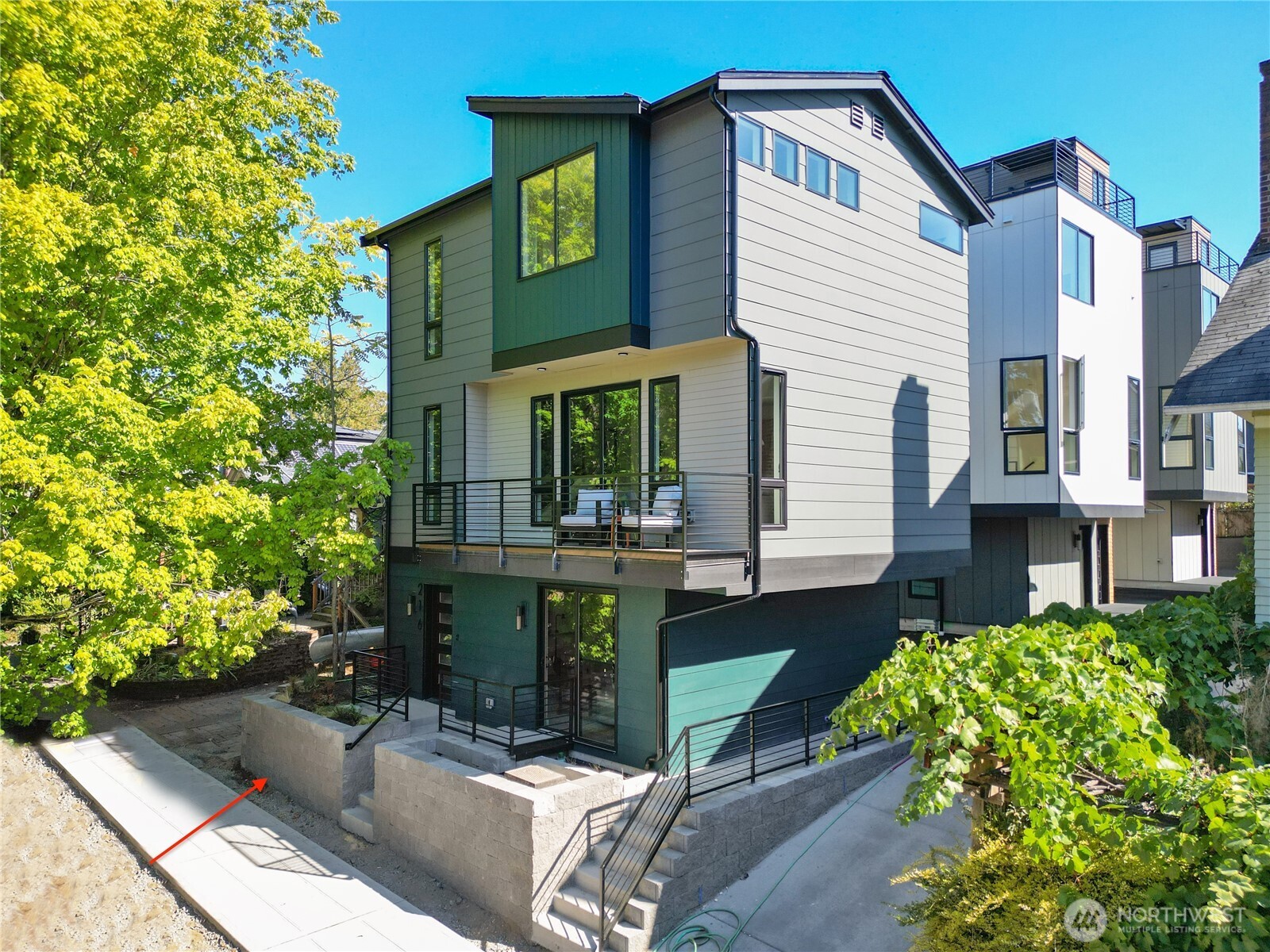 220 21st Avenue East Seattle, WA 98112 - Photo 33 of 38 a front view of a house with garden