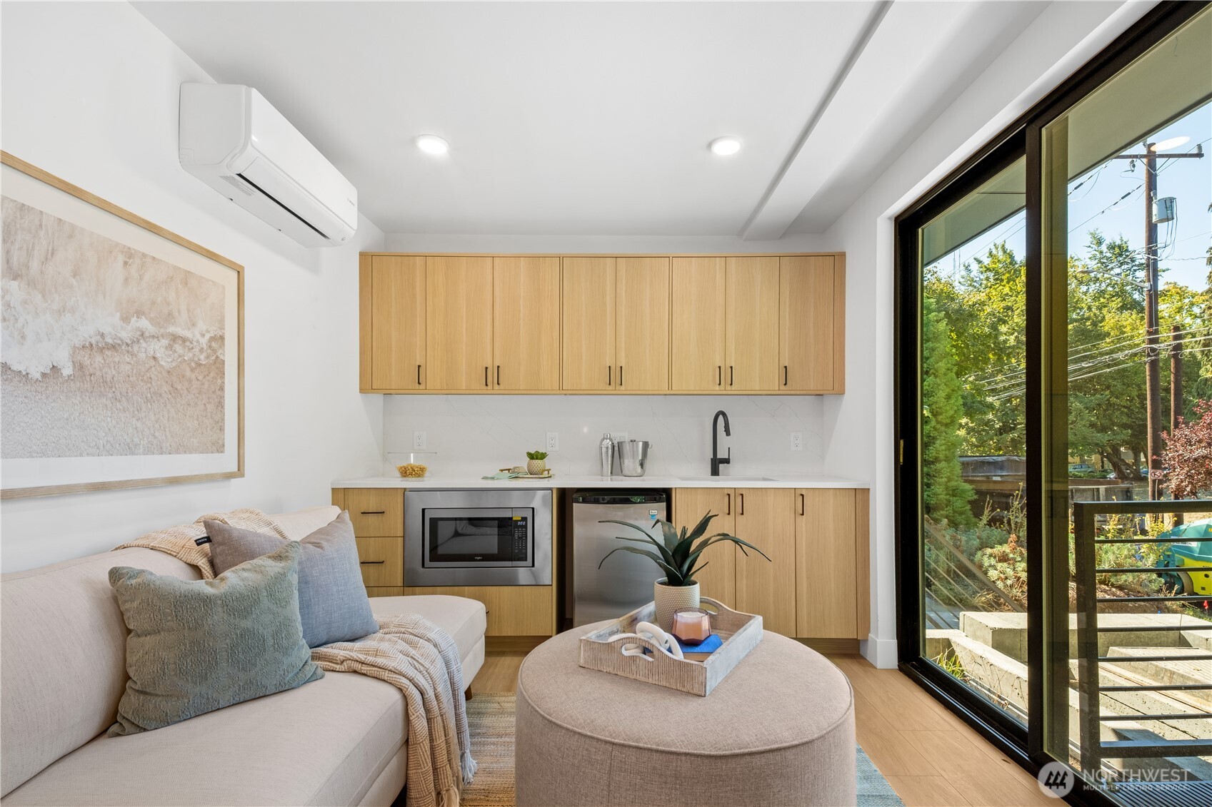 220 21st Avenue East Seattle, WA 98112 - Photo 6 of 38 a living room with furniture and a floor to ceiling window