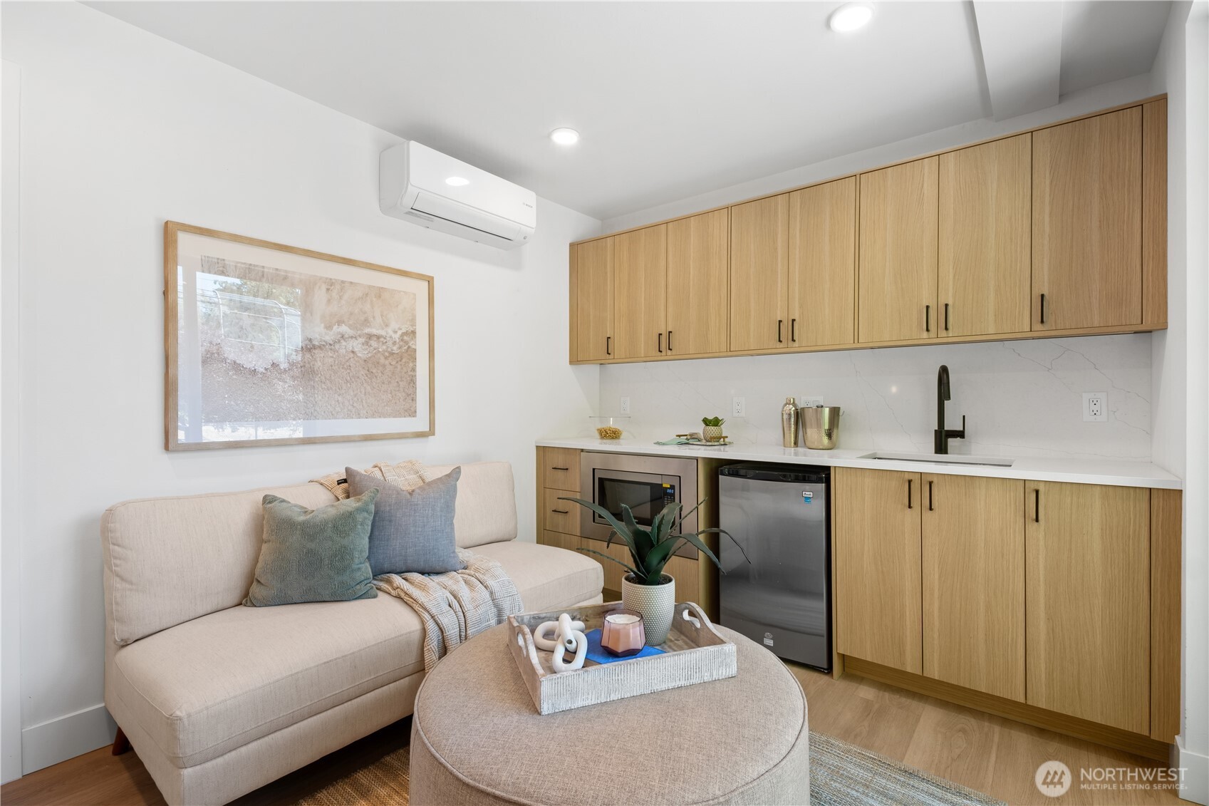220 21st Avenue East Seattle, WA 98112 - Photo 7 of 38 a living room with furniture and a painting on the wall