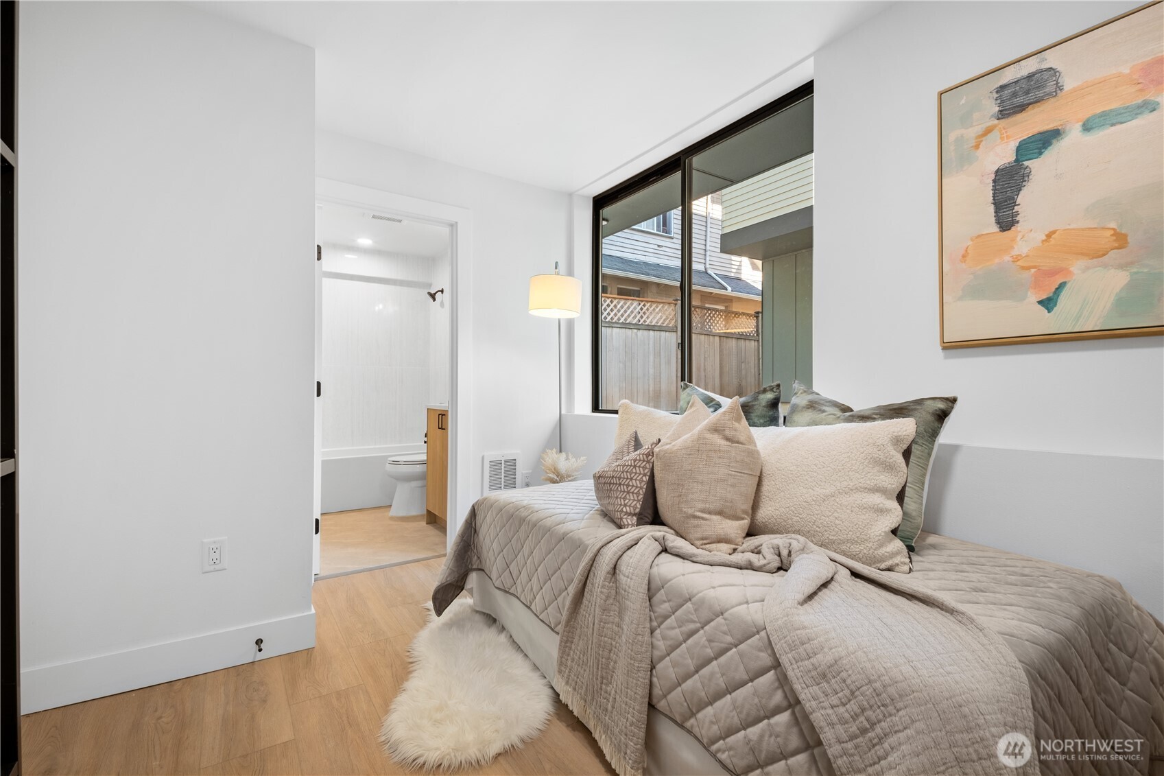 220 21st Avenue East Seattle, WA 98112 - Photo 9 of 38 a bedroom with a bed and a painting on the wall