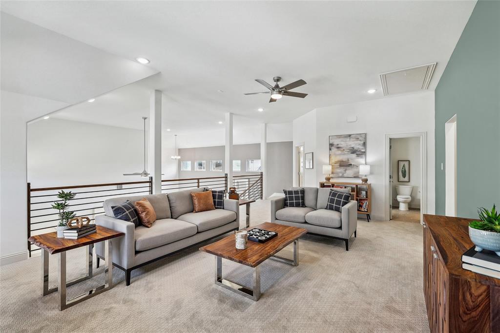 1604 Casting Ridge Mesquite, TX 75181 - Photo 25 of 38 Open-concept loft area featuring carpeted flooring, a ceiling fan, recessed lighting, and a modern horizontal slat railing system