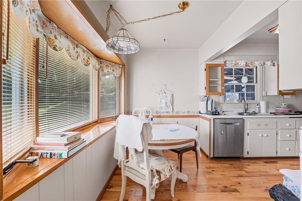 6453 Old Pulaski Road New Wilmington, PA 16142 - Photo 12 of 28 a kitchen with a table chairs stove and cabinets