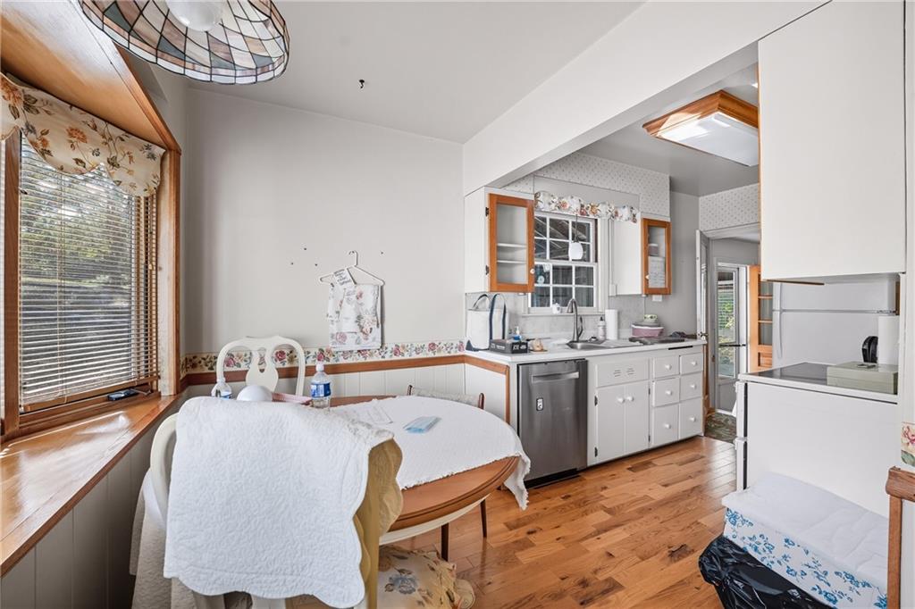 6453 Old Pulaski Road New Wilmington, PA 16142 - Photo 13 of 28 a kitchen with a sink stove and cabinets