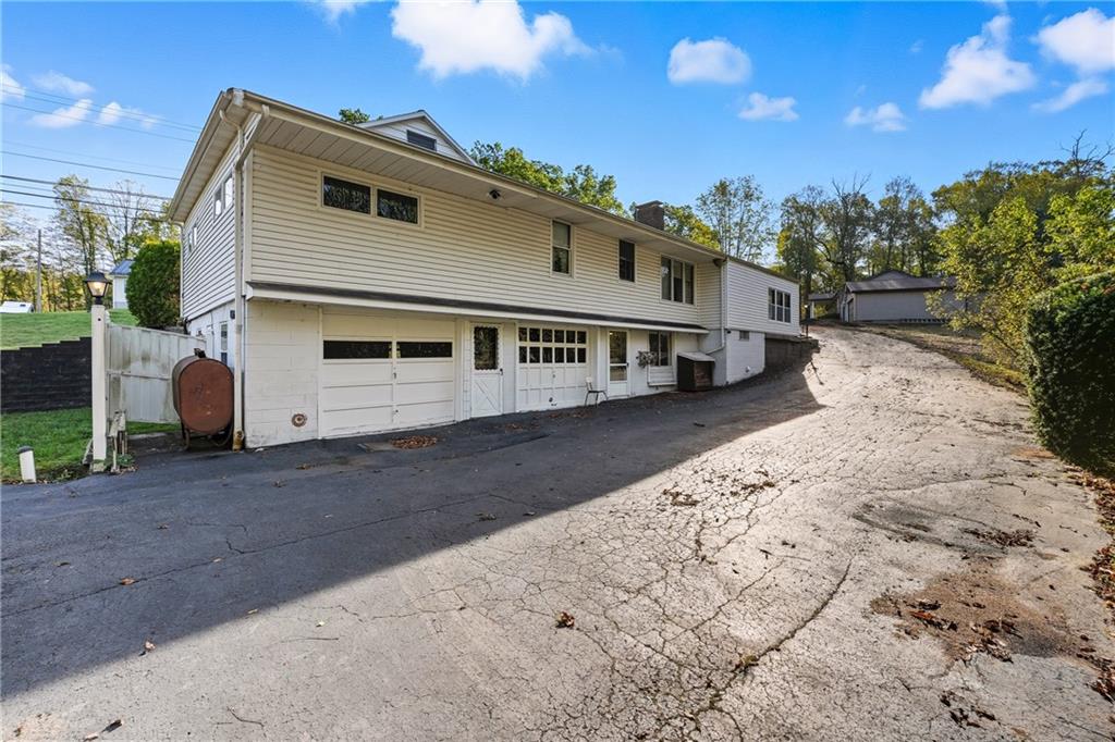 6453 Old Pulaski Road New Wilmington, PA 16142 - Photo 5 of 28 a view of a white house with a yard