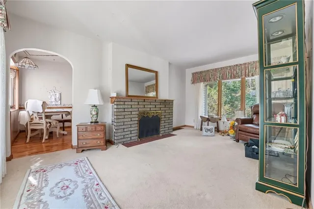 a bedroom with furniture and a fireplace