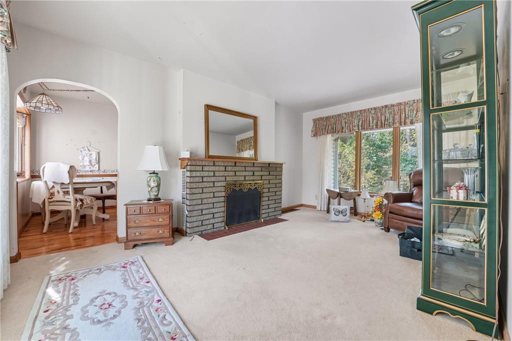 6453 Old Pulaski Road New Wilmington, PA 16142 - Photo 8 of 28 a bedroom with furniture and a fireplace