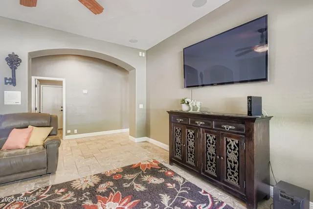 a bedroom with a bed and flat screen tv