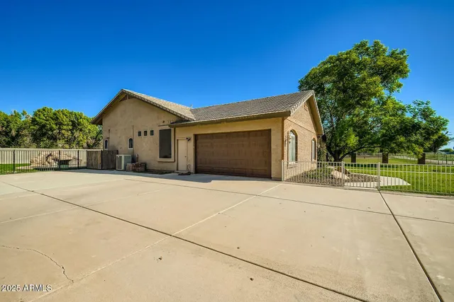 a view of garage yard and tree