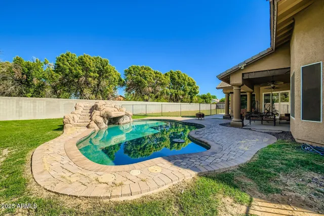 a view of a swimming pool with a patio