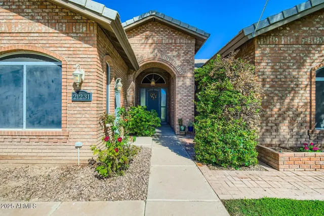 a front view of a house with garden