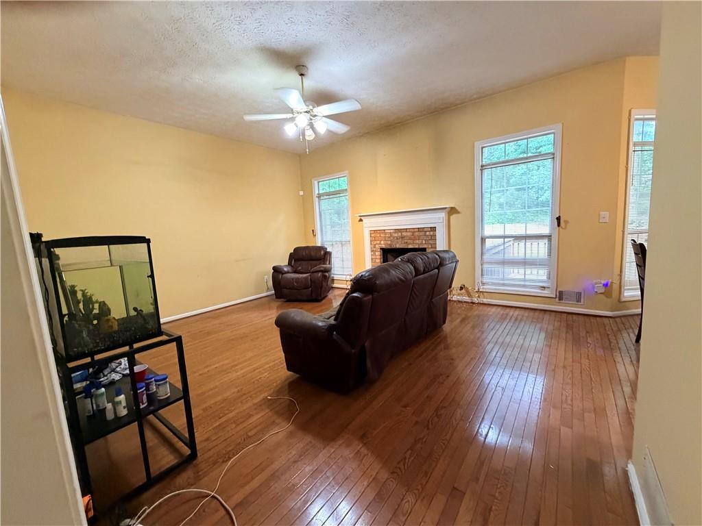 426 Pates Lake Court Hampton, GA 30228 - Photo 50 of 60 a living room with furniture and a window