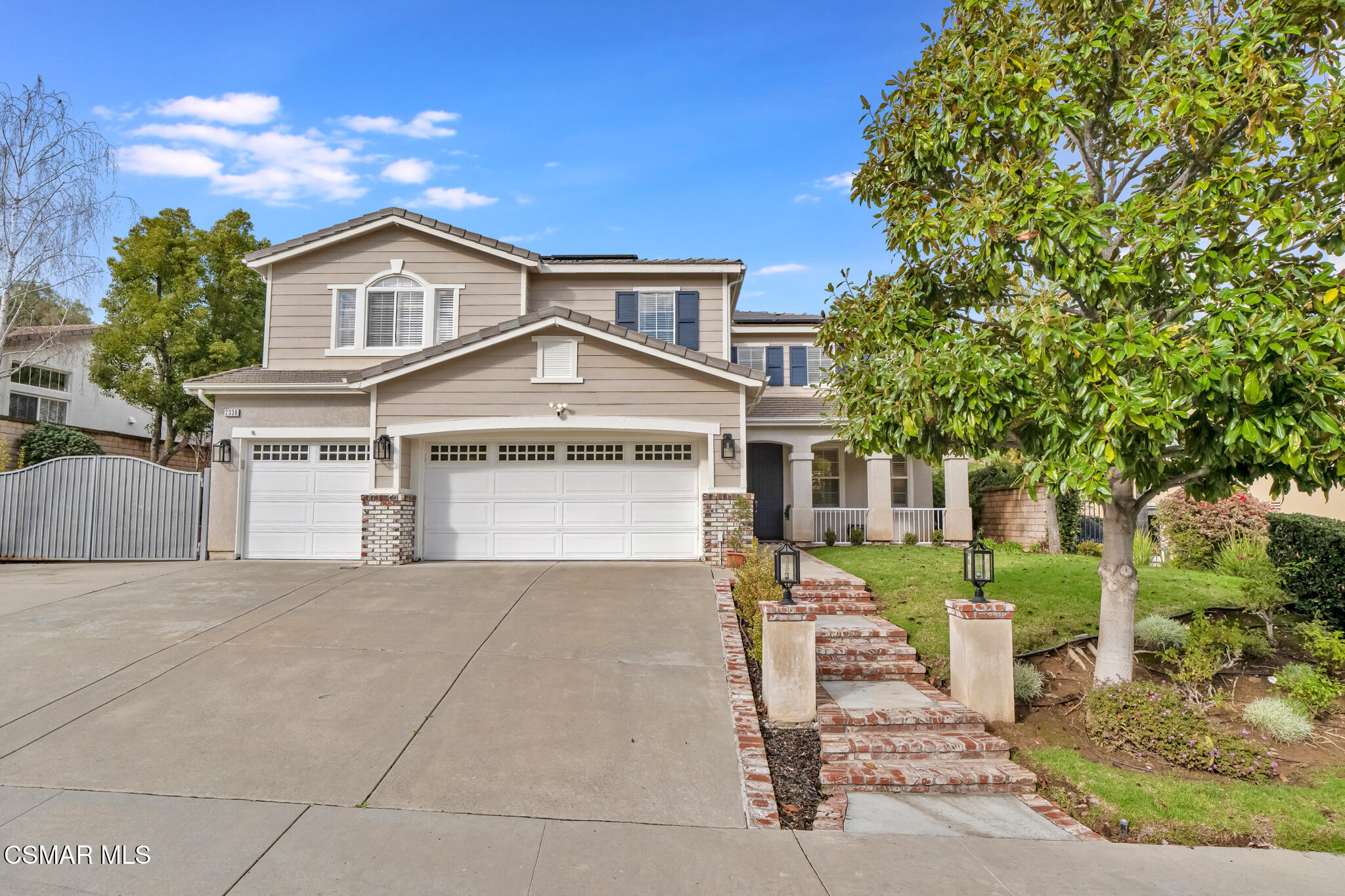 2339 Rudolph Drive Simi Valley, CA 93065 - Photo 1 of 61 a front view of a house with a yard and trees