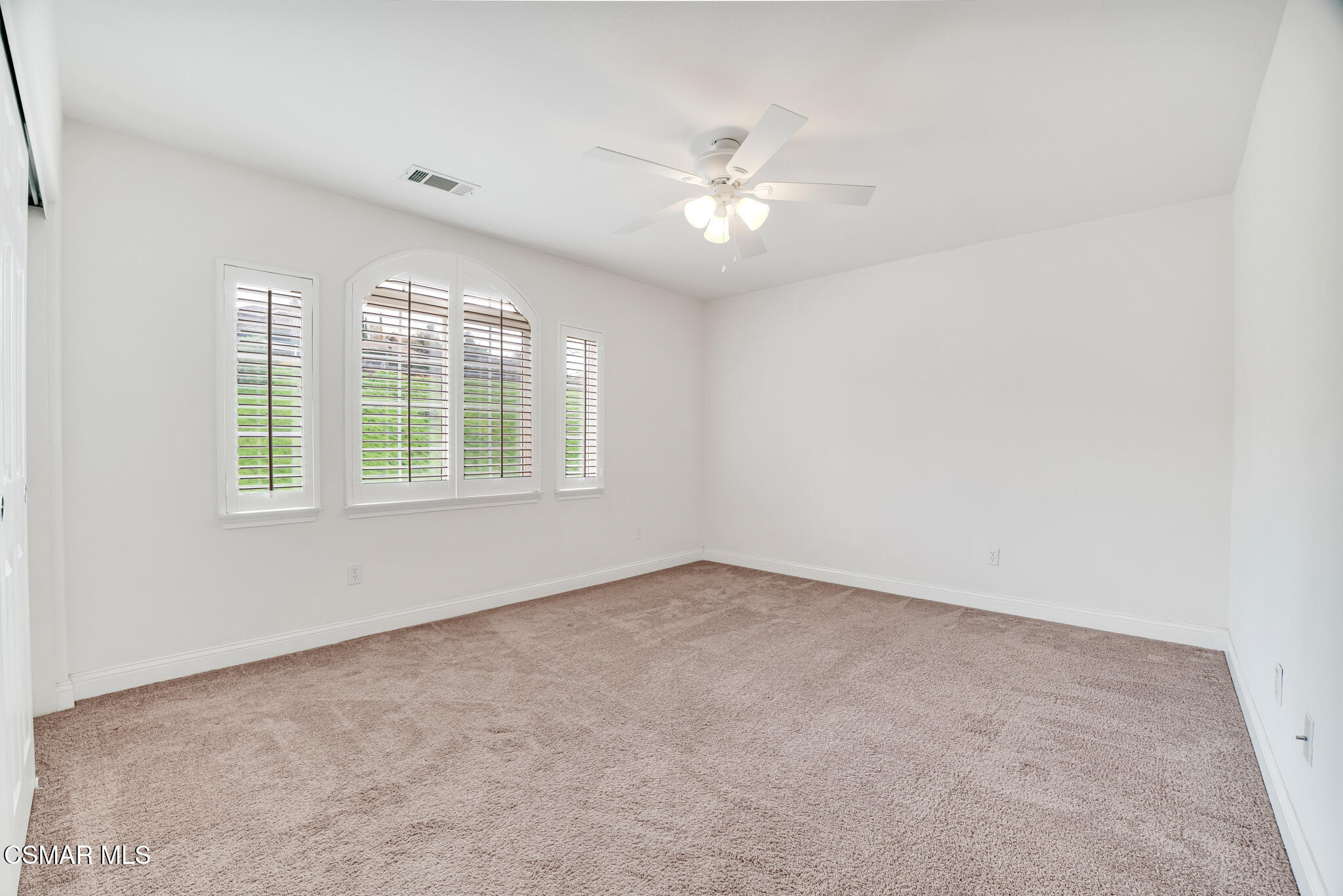 2339 Rudolph Drive Simi Valley, CA 93065 - Photo 32 of 61 an empty room with windows and chandelier fan