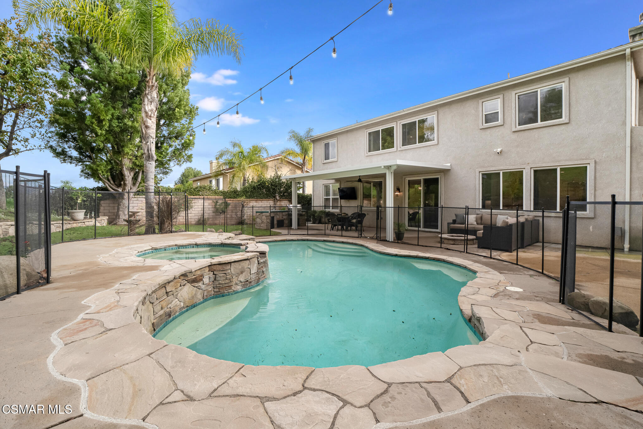 2339 Rudolph Drive Simi Valley, CA 93065 - Photo 42 of 61 a swimming pool with outdoor seating and yard