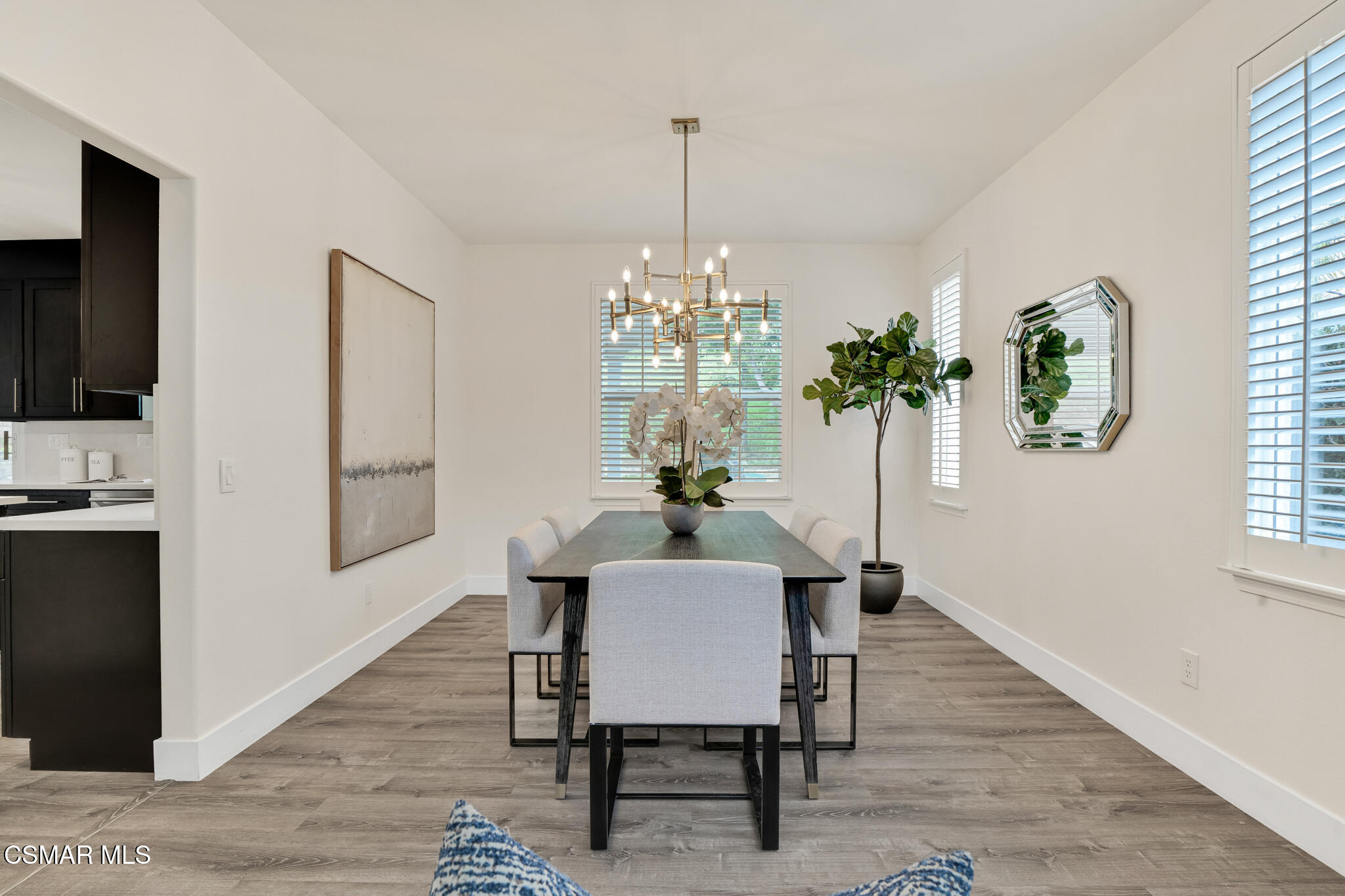 2339 Rudolph Drive Simi Valley, CA 93065 - Photo 10 of 61 a dining room with furniture potted plants and wooden floor