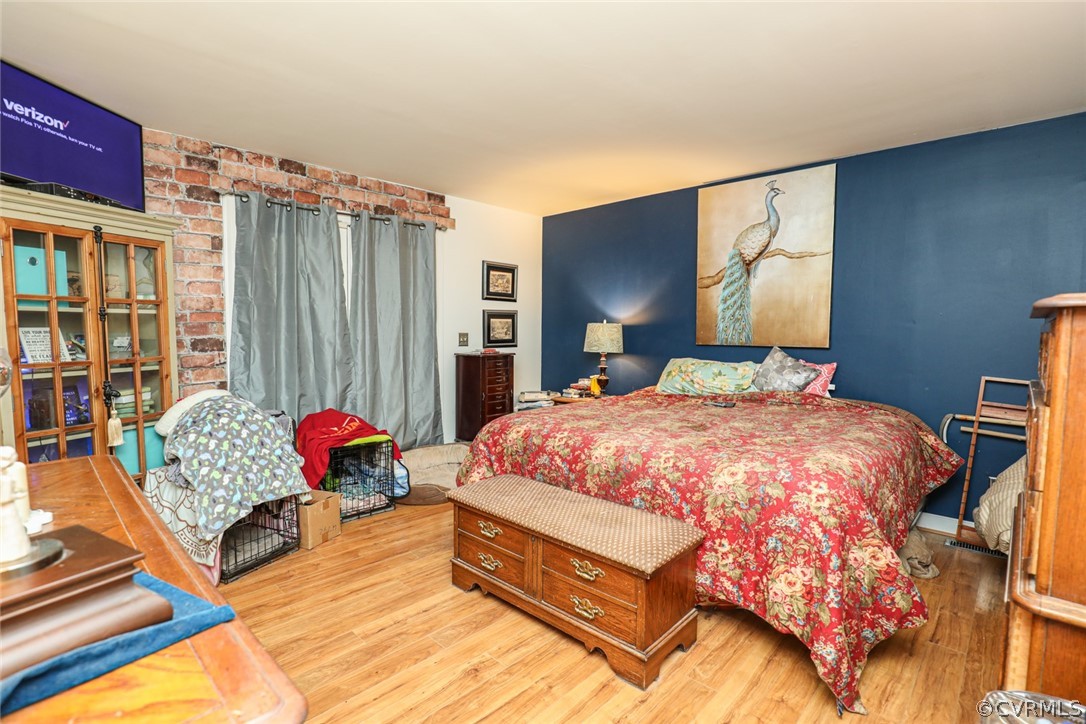 13120 Hensley Road Midlothian, VA 23112 - Photo 17 of 50 a spacious bedroom with a bed and a couch