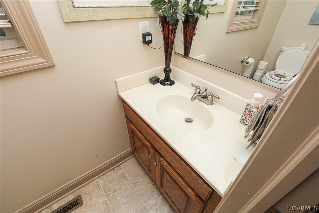 13120 Hensley Road Midlothian, VA 23112 - Photo 34 of 50 a bathroom with a sink and a mirror