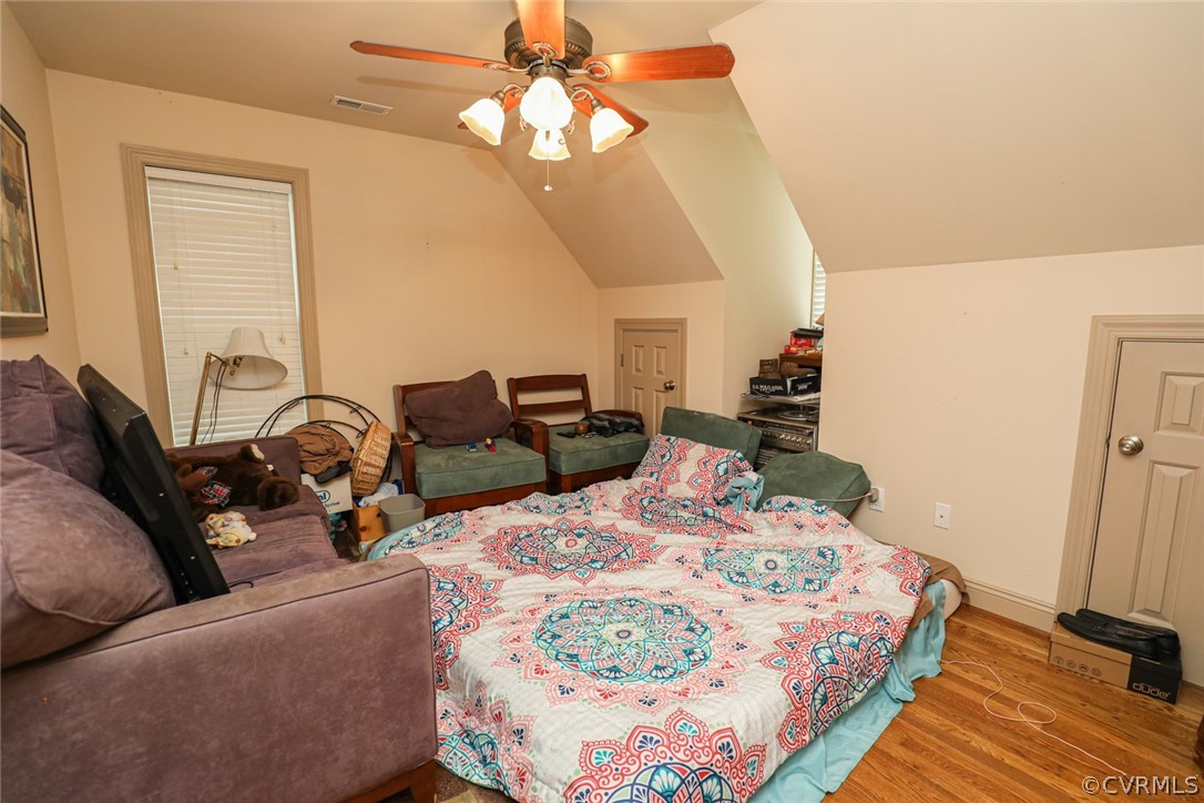 13120 Hensley Road Midlothian, VA 23112 - Photo 42 of 50 a bed room with bed and a chandelier