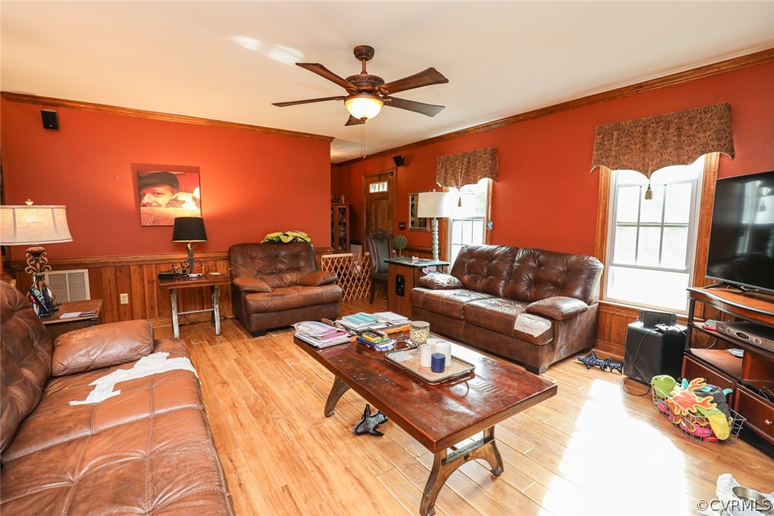 13120 Hensley Road Midlothian, VA 23112 - Photo 8 of 50 a living room with furniture a chandelier and a flat screen tv