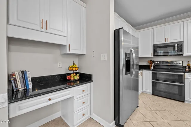 a view of a dining room with furniture and window