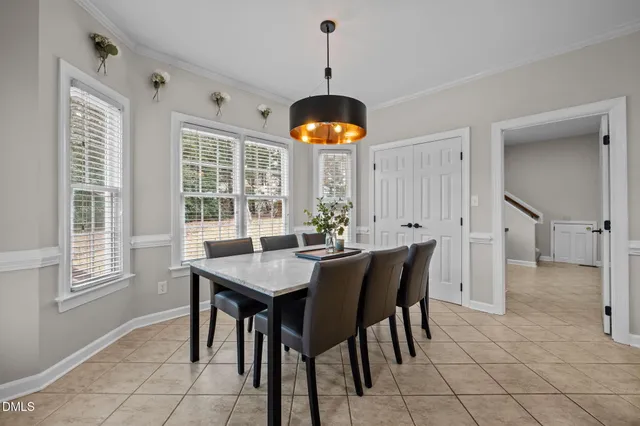 a kitchen with cabinets and wooden floor