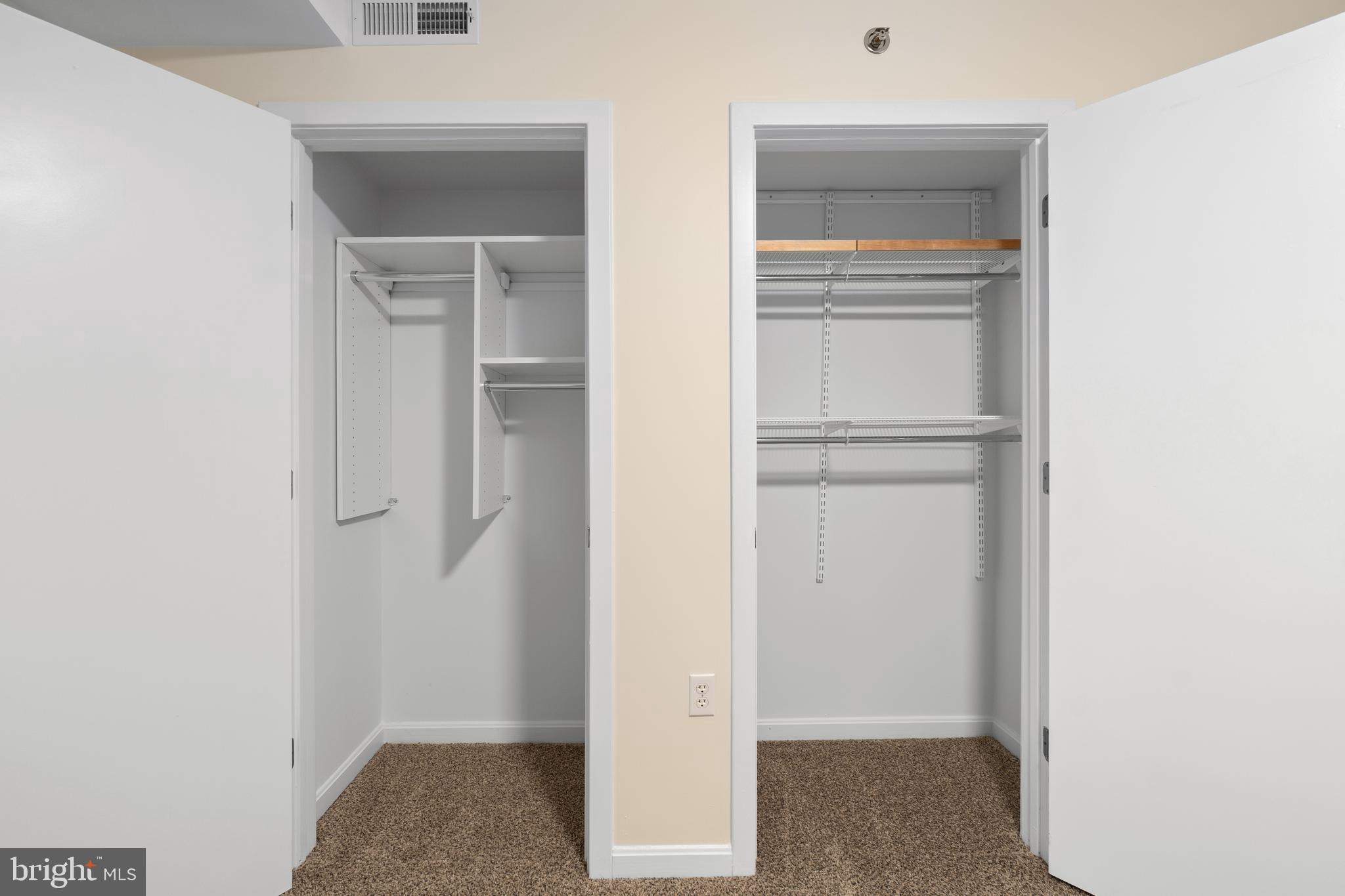 7981 Eastern Avenue Northwest, Unit 219 Silver Spring, MD 20910 - Photo 30 of 45 Primary bedroom closets both have organizers