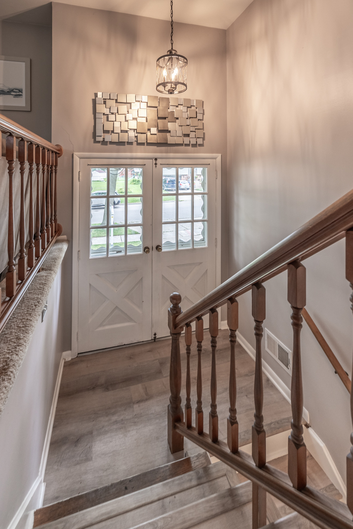 503 Ridge Circle Streamwood, IL 60107 - Photo 3 of 25 a view of entryway and hall with wooden floor