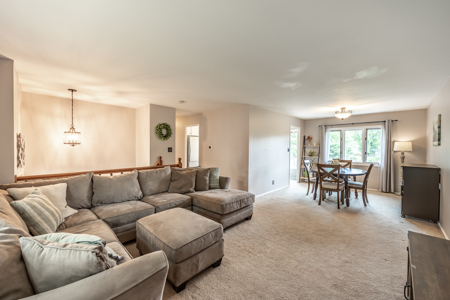 503 Ridge Circle Streamwood, IL 60107 - Photo 5 of 25 a living room with furniture and a dining table with chandelier