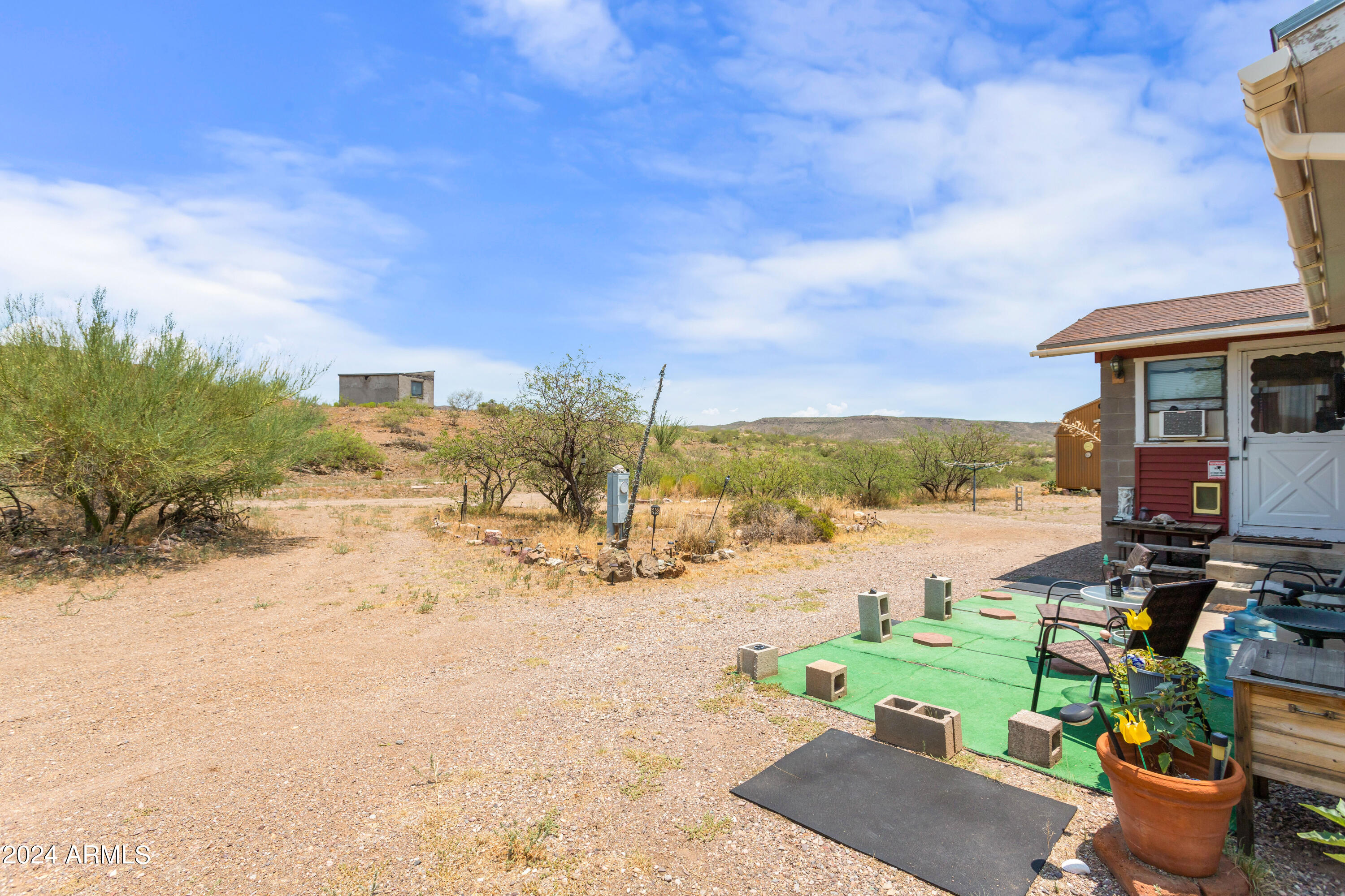 4500 Highway 80 Douglas, AZ 85607 - Photo 27 of 40 a view of a terrace with chairs and a swimming pool