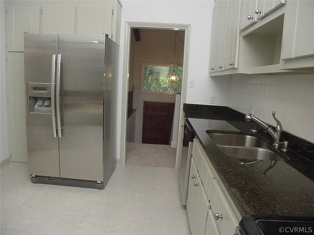 7905 Stiles Road North Chesterfield, VA 23235 - Photo 14 of 47 Refrigerator conveys. Ceramic tile floor in kitche
