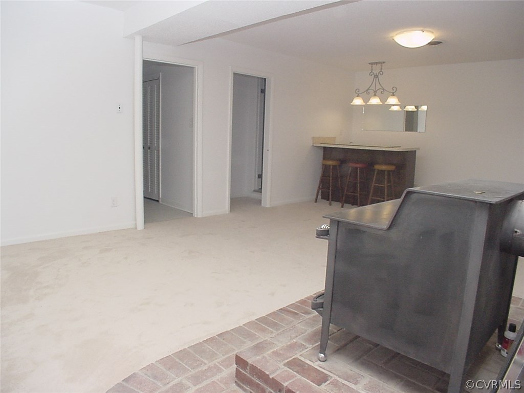 7905 Stiles Road North Chesterfield, VA 23235 - Photo 24 of 47 Family room has Fisher wood stove on a brick heart