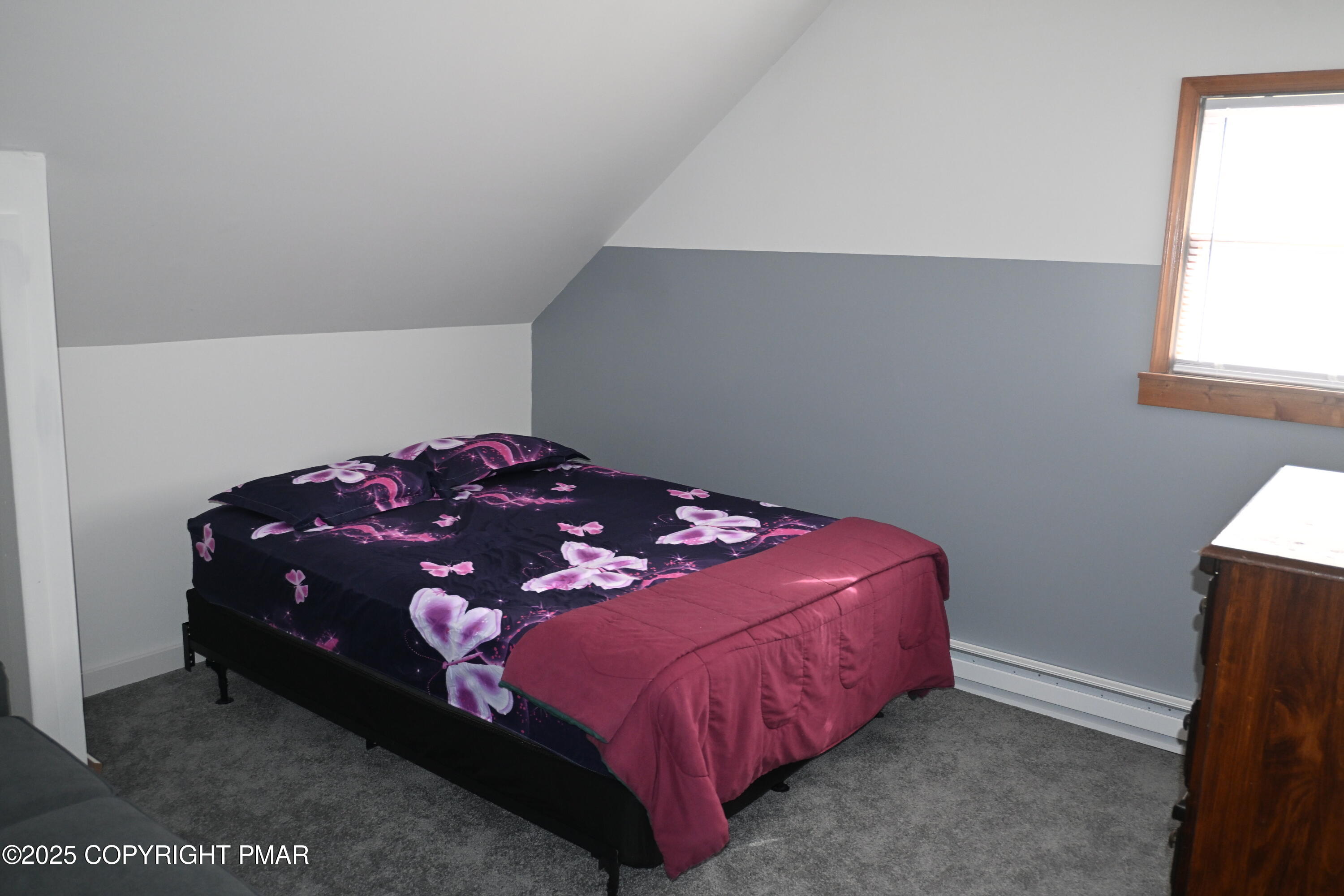 222 Nadine Boulevard Pocono Summit, PA 18346 - Photo 13 of 16 a bedroom with a bed and window