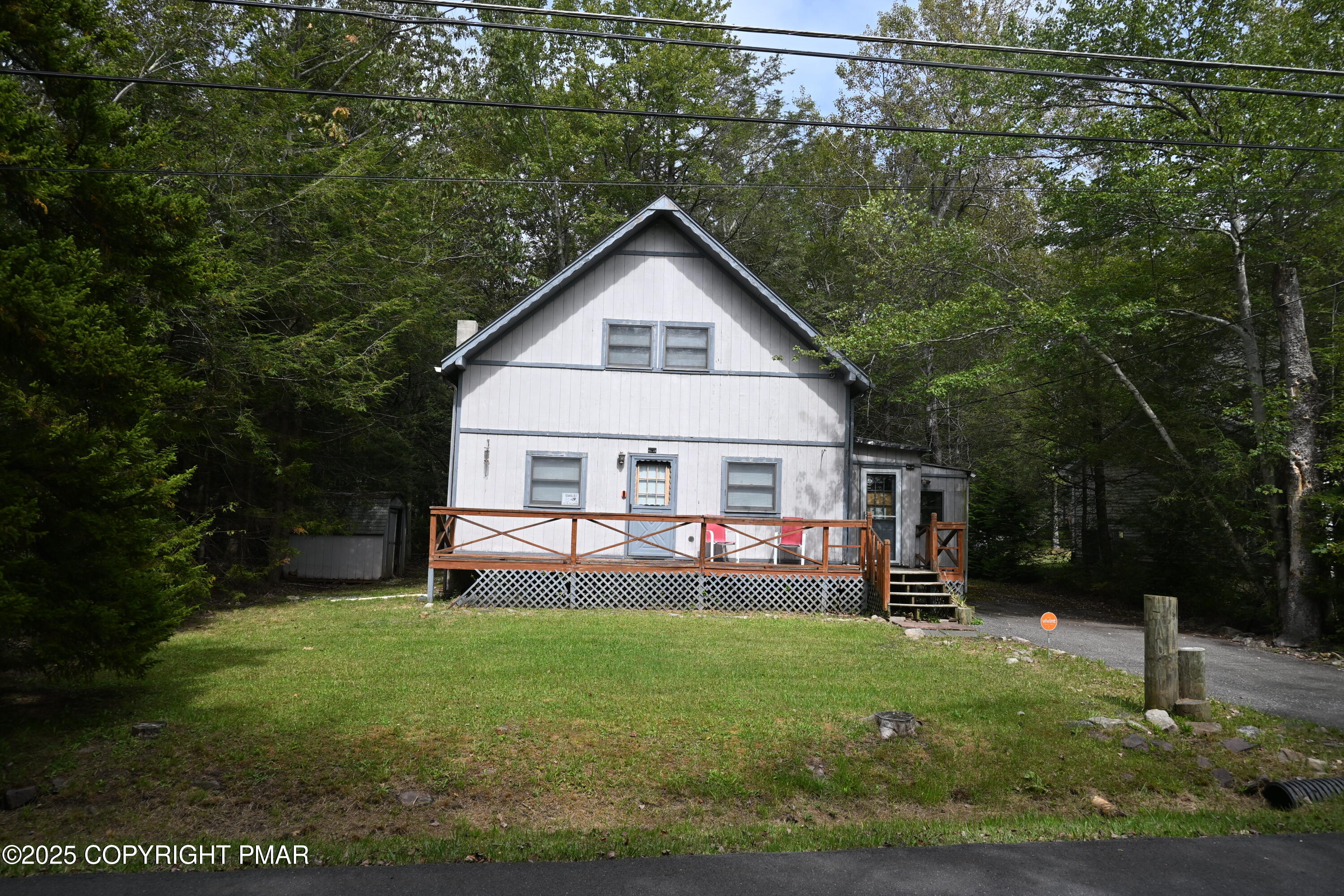 222 Nadine Boulevard Pocono Summit, PA 18346 - Photo 16 of 16 a house view with a garden space