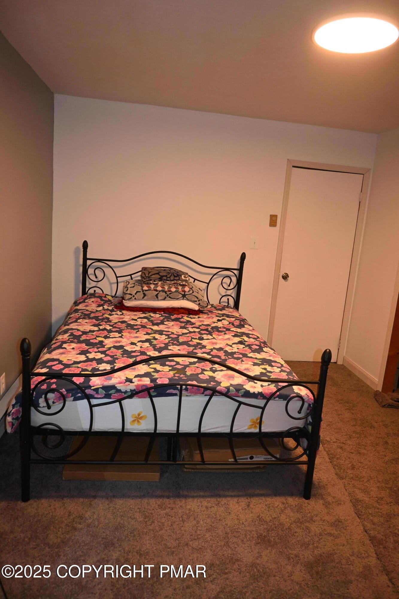 222 Nadine Boulevard Pocono Summit, PA 18346 - Photo 8 of 16 a bedroom with a bed and wooden floor