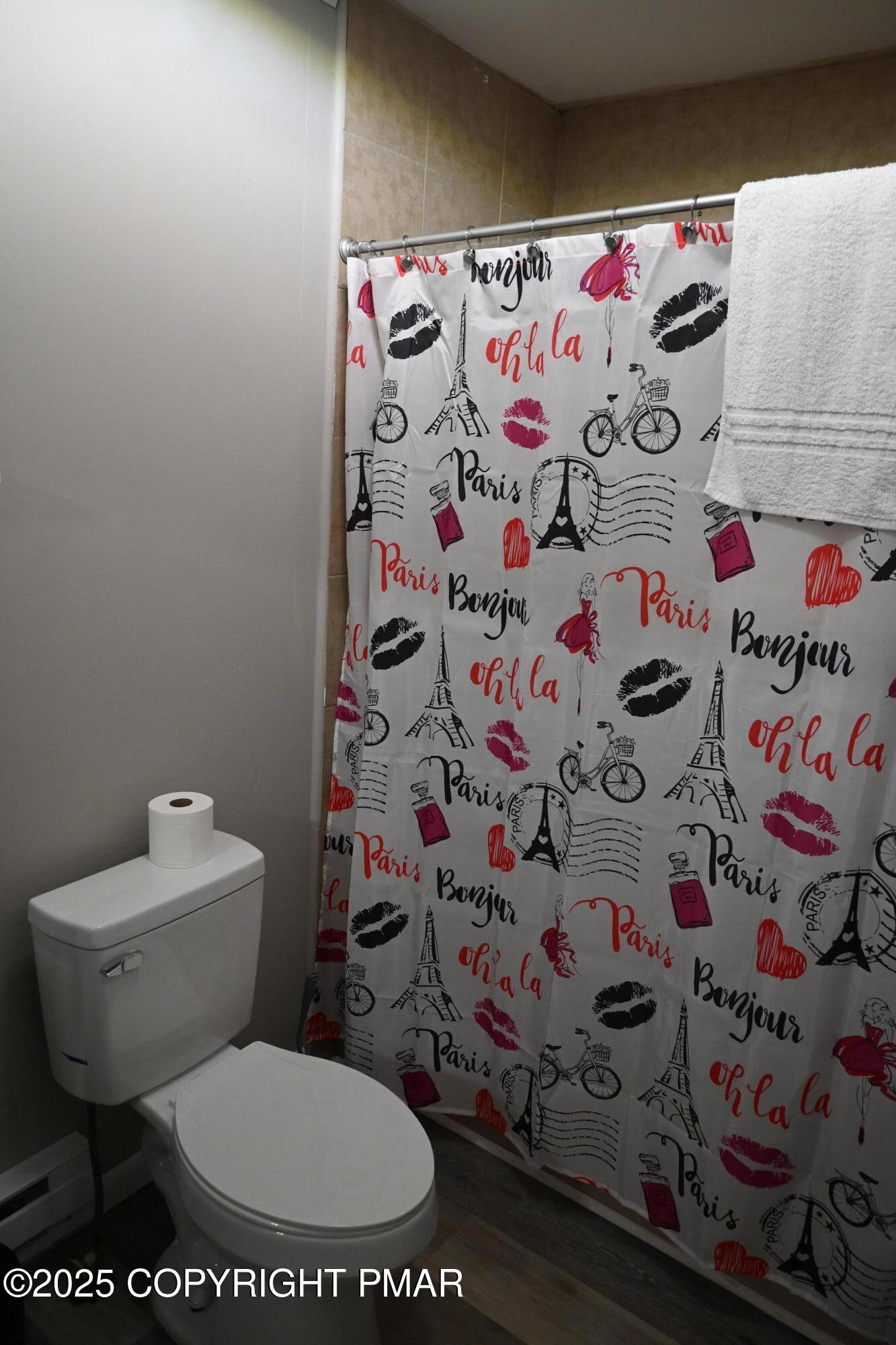 222 Nadine Boulevard Pocono Summit, PA 18346 - Photo 10 of 16 a white toilet sitting next to a shower curtain