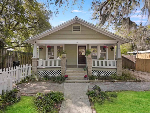 a front view of a house with a fence