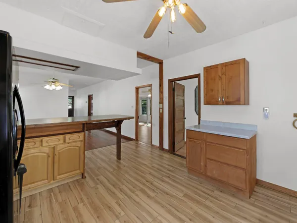 a view of a kitchen from the hallway