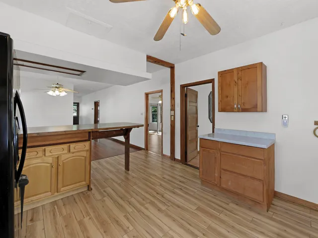 a view of a kitchen from the hallway