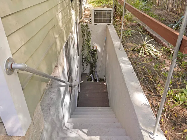 a view of backyard with a deck and wooden floor