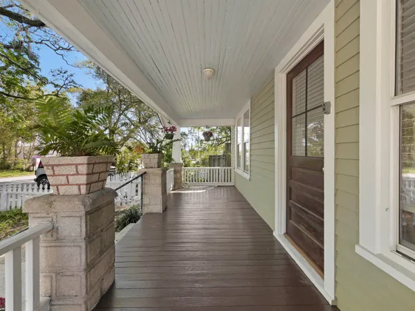 a view of a balcony with wooden floor