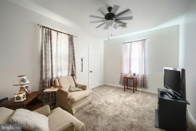 an aerial view of residential houses with outdoor space and river