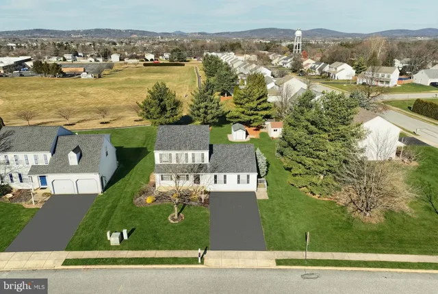 an aerial view of a house with a garden